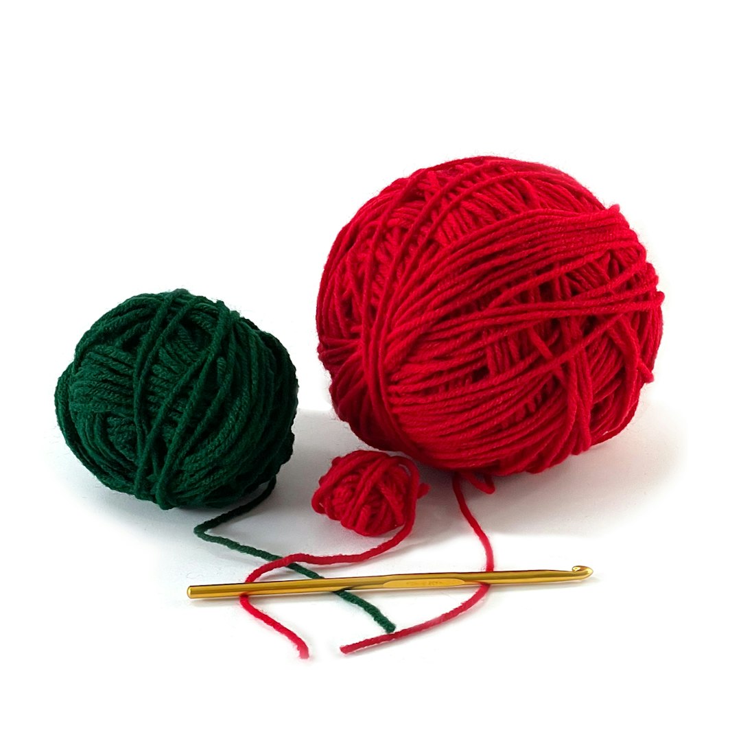 Crochet yarn and hook used for a granny stitch bandana
